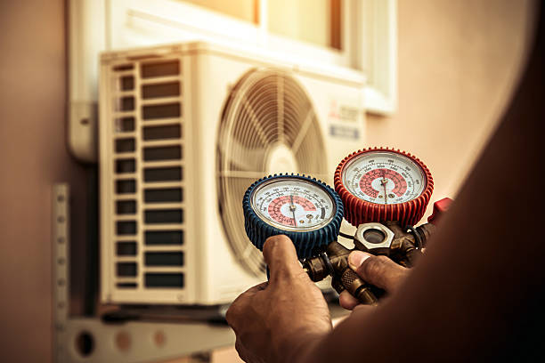 Professional Air Conditioning Service technician working in Magnolia, OH